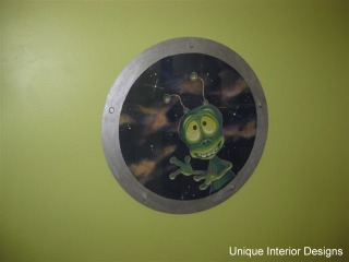 Friendly Alien Peeks Through Porthole